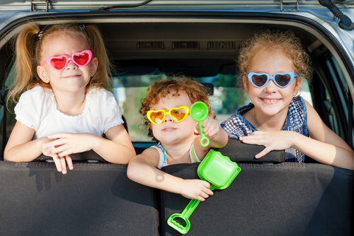 children in car with sunglasses